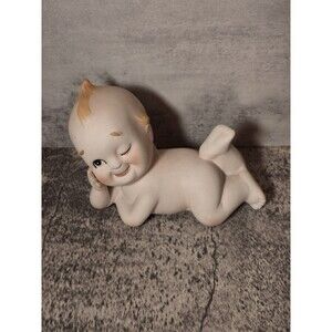 VINTAGE LEFTON KEWPIE BISQUE PIANO BABY figurine winking about 5" long